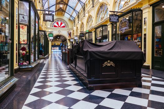 Melbourne, Australia - August 17, 2020: Collins St within Melbourne CBD is quiet and deserted during the Coronavirus pandemic. Melbourne is currently under Stage 4 lockdown and night curfew after a 2nd wave of infections.