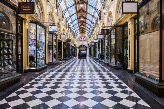 Melbourne, Australia - August 17, 2020: Collins St within Melbourne CBD is quiet and deserted during the Coronavirus pandemic. Melbourne is currently under Stage 4 lockdown and night curfew after a 2nd wave of infections.