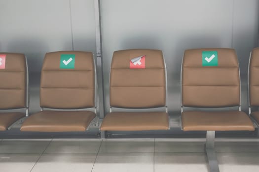 social distancing passenger chair in airport. coronavirus covid-19 pandemic prevention