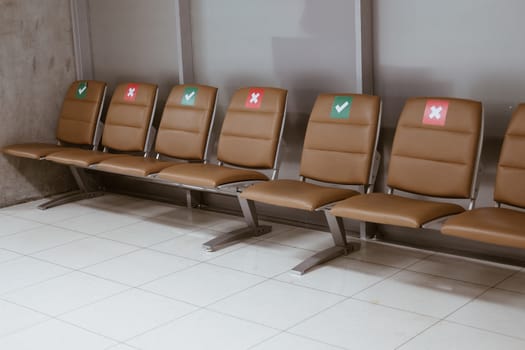 social distancing passenger chair in airport. coronavirus covid-19 pandemic prevention
