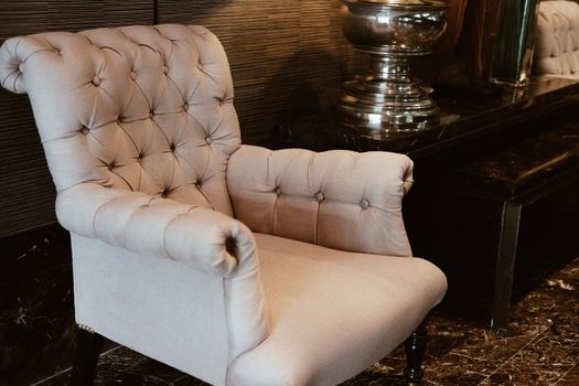 beige cushion sofa chair armchair in living room. home interior