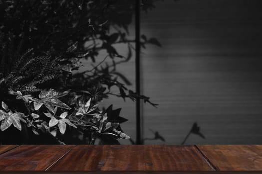 artificial flower bouquet with leaves shadow on wall