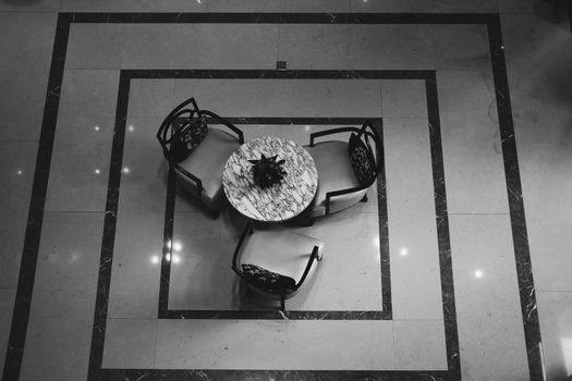 plant pot & leather cushion wooden chair in living room. home interior