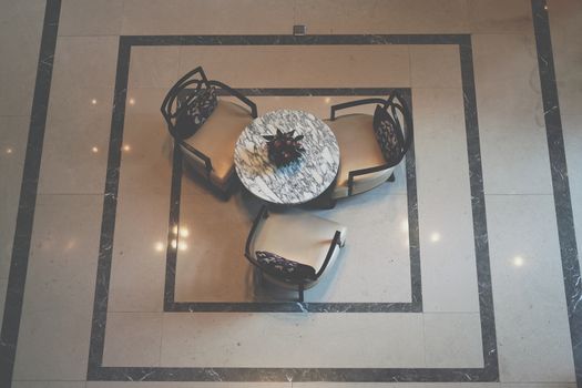 plant pot & leather cushion wooden chair in living room. home interior