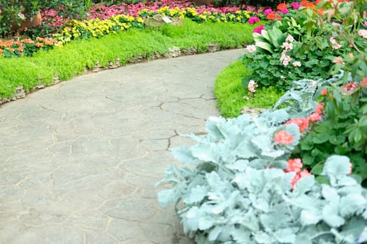 walkway pathway in flower garden park. tranquil nature scene