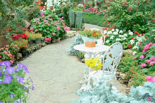 orange flower bouquet on metal table in flower garden park