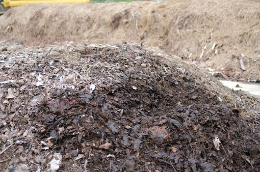 organic compost heap. fertilizer production for soil cultivation in agriculture industry