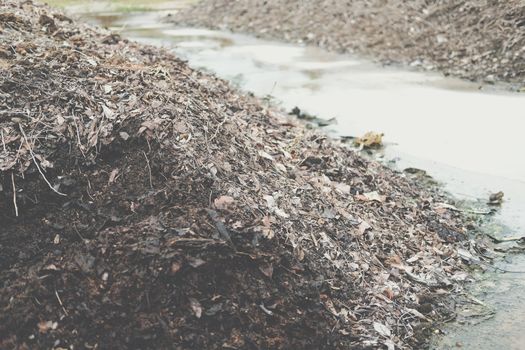 organic compost heap. fertilizer production for soil cultivation in agriculture industry