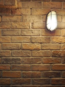 Brick wall old dirty texture background and hanging lamp and yellow light and flare in to camera.