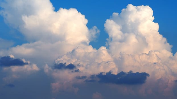 Blue sky and white clouds and landscape of city building in evening time.