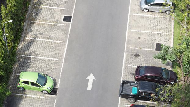 Car parking space and concrete road outdoor and white arrow and top view angle.