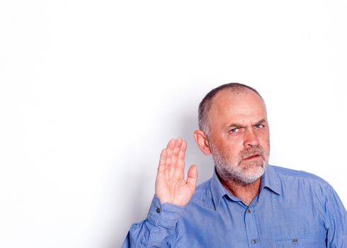 the man in blue shirt putting his hand near his ear on white background