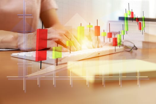 Business and technology concept  Close up Business women hands with keybord and candlestick chart background. Business people hands use computer network control trade buy and sell stock market
