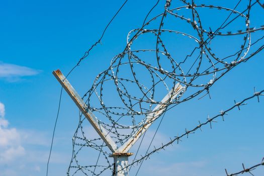 Barbed wire on top of a fence to protect territories