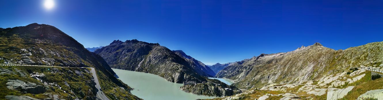 panorama scenery of the swiss alps. Lake at the top of grimsel pass at 2168 meters. Clean air