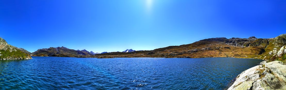 panorama scenery of the swiss alps. Lake at the top of grimsel pass at 2168 meters. Clean air