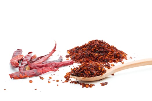 Dried chili meal on a white background