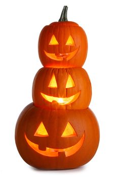 Pile of glowing Carved Halloween Pumpkins isolated on white background
