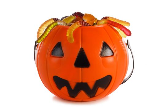 Halloween Jack o Lantern candy collector with worm candy isolated on white background