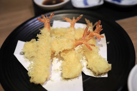 Shrimp tempura looks delicious on the plate. In a japanese restaurant. Selective focus.