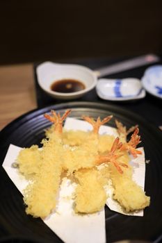 Shrimp tempura looks delicious on the plate. In a japanese restaurant. Selective focus.