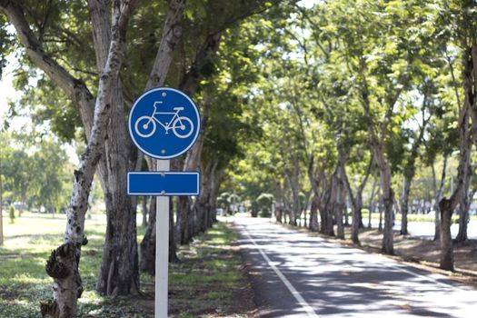 Signboard showing bike lane in a park.
