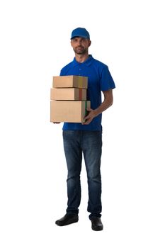 Handsome delivery man with stack of boxes isolated on white background, full length portrait