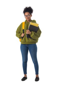 Friendly ethnic black female high school student in eyeglasses with backpack and composition book isolated on white background, full length portrait