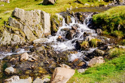 Close up of small waterfall at Kirkstone Pass Lake District UK