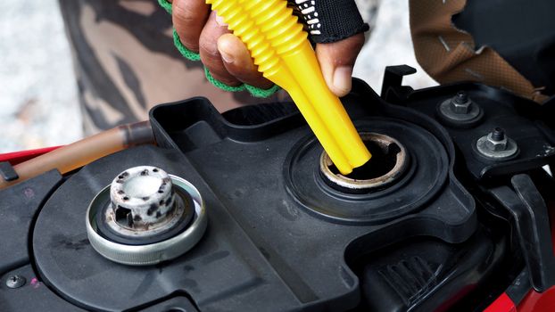 Fuel tank of motorcycle that opened and waiting for oil or gasoline and high angle view.