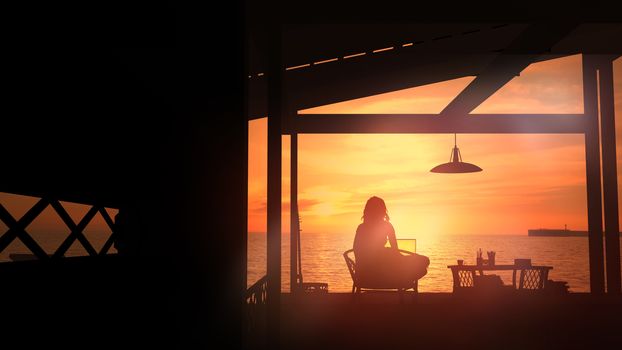 Silhouette of a girl working on a laptop in her room on the seashore at sunset.