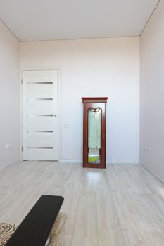 The interior of an empty room as a result of preparations for the move