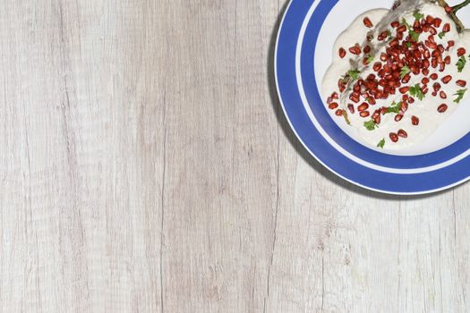 Top view of chiles en nogada, traditional festive dish on Mexican Independence Day. Green chili peppers with walnut sauce, common food for Mexico, in celebrations and national holidays. Copy Space