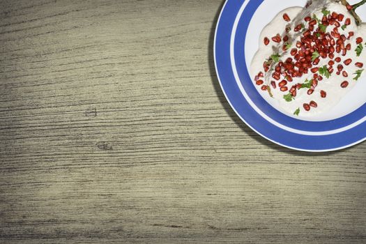 Top view of chiles en nogada, traditional festive dish on Mexican Independence Day. Green chili peppers with walnut sauce, common food for Mexico, in celebrations and national holidays. Copy Space