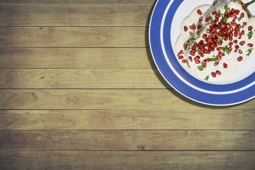 Top view of chiles en nogada, traditional festive dish on Mexican Independence Day. Green chili peppers with walnut sauce, common food for Mexico, in celebrations and national holidays. Copy Space