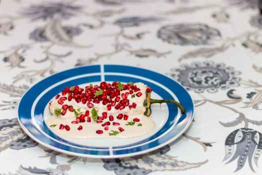 Chile en nogada, traditional festive dish on Mexican Independence Day. Green chili peppers with walnut sauce. National holidays