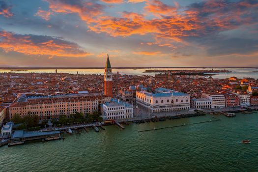 The famous San Marco Campanile and the Doges Palace in front of the Grand Canal in Venice on sunny day in north Italy