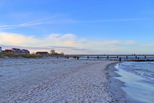 Beach life with some people in the distance in Schoenberg in northern Germany