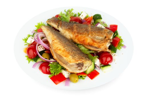 Baked seabass with greek salad mediterranean cuisine on white plate isolated on white background