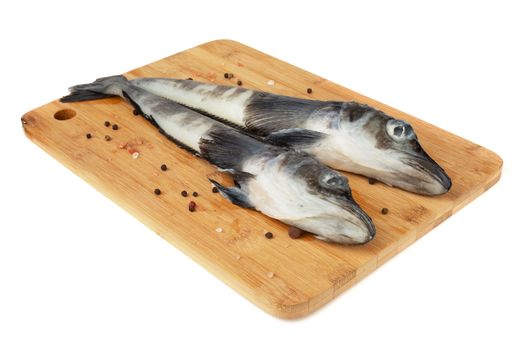 Fresh raw Mackerel Icefish ice fish on wooden cutting board isolated on white background