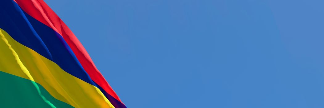 3D rendering of the national flag of Mauritius waving in the wind against a blue sky