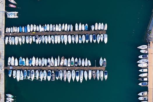 Aerial bird eye view of sailboats and yachts moored in Lovere port, Iseo lake near Bergamo,Italy.