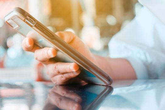 Closeup Image of Women Hand holding a smartphone