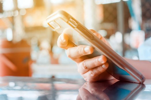 Closeup Image of Women Hand holding a smartphone