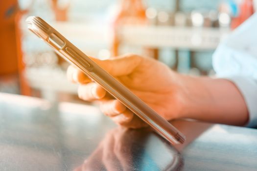 Closeup Image of Women Hand holding a smartphone