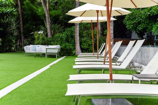 Image of Chaise longue at the pool in tropical resort