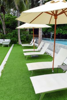 Image of Chaise longue at the pool in tropical resort