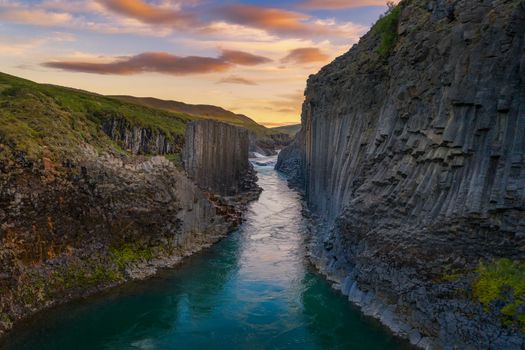 Studlagil Canyon with the Jokulsa A Bru river in east Iceland photographed at sunset.