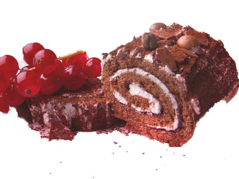 Closeup of a coffee cake roll topped with a bunch of grapes isolated on white background.