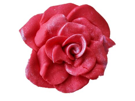 Soft focus of a pink gum paste candy rose isolate on white background.